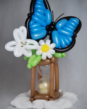 memories balloon sculpture of butterfly on hourglass and flowers