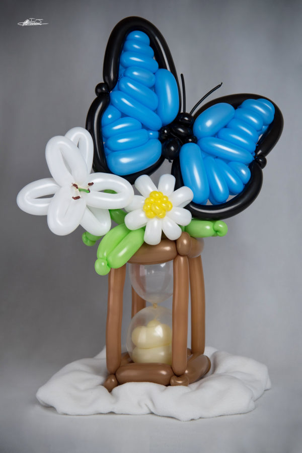 memories balloon sculpture of butterfly on hourglass and flowers