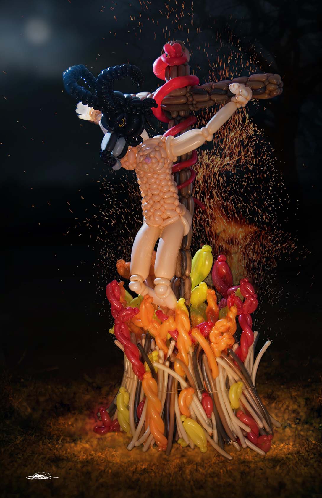 The Burning of the Witch balloon sculpture of naked woman with goat head crucified at a burning stake with a red snake sitting at the top