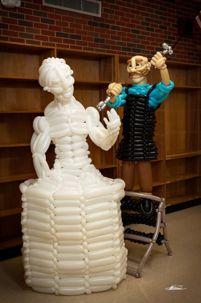 The Sculptor balloon sculpture man sculpting marble statue