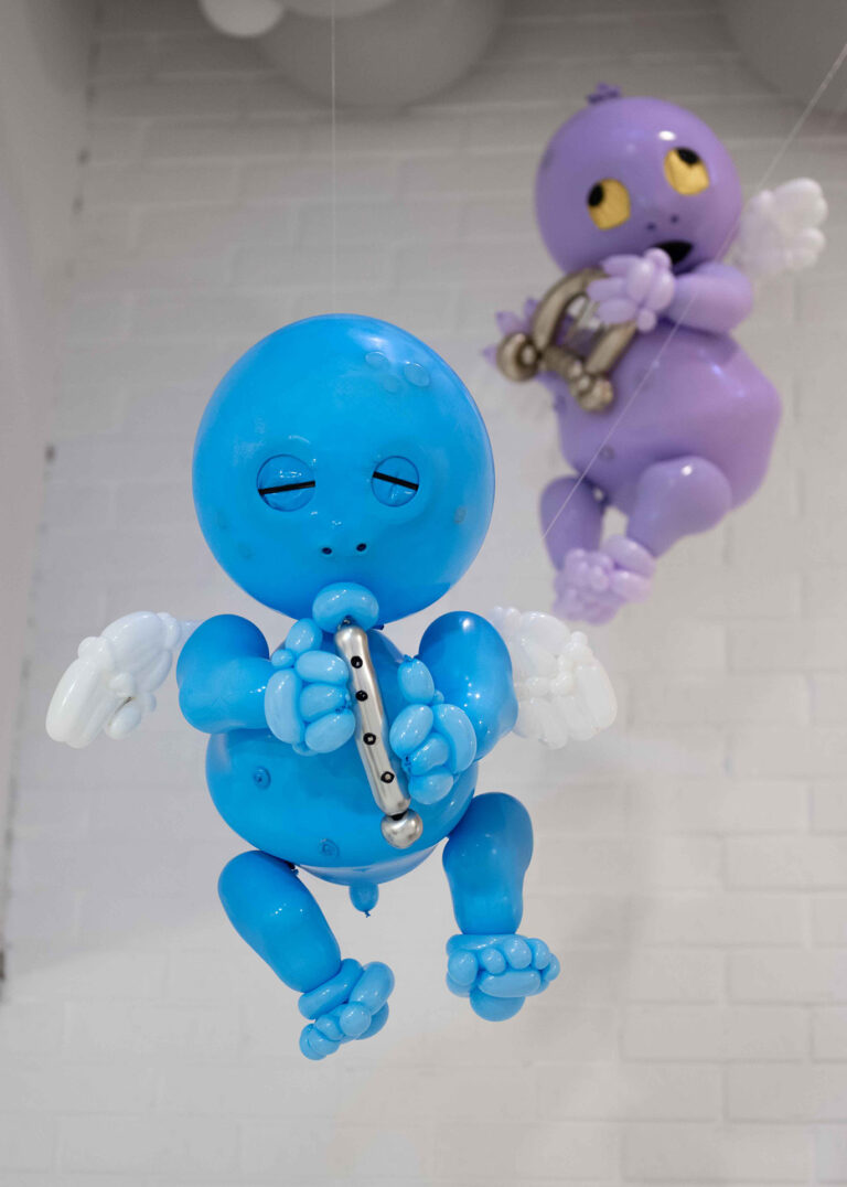 cherub imps blue and purple flying and playing instruments flute and harp