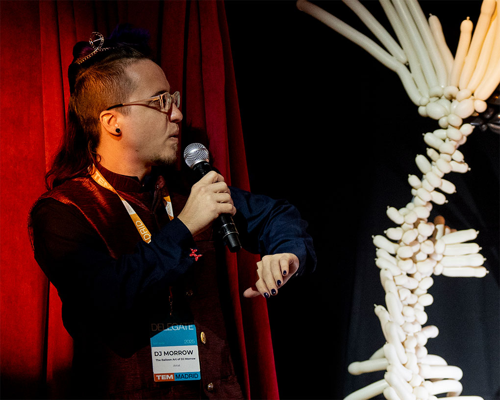 artist dj morrow talking next to koi sculpture at tem