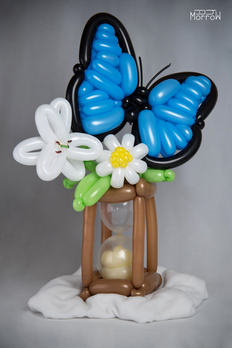 memories balloon sculpture blue butterfly white lily daisy and hourglass