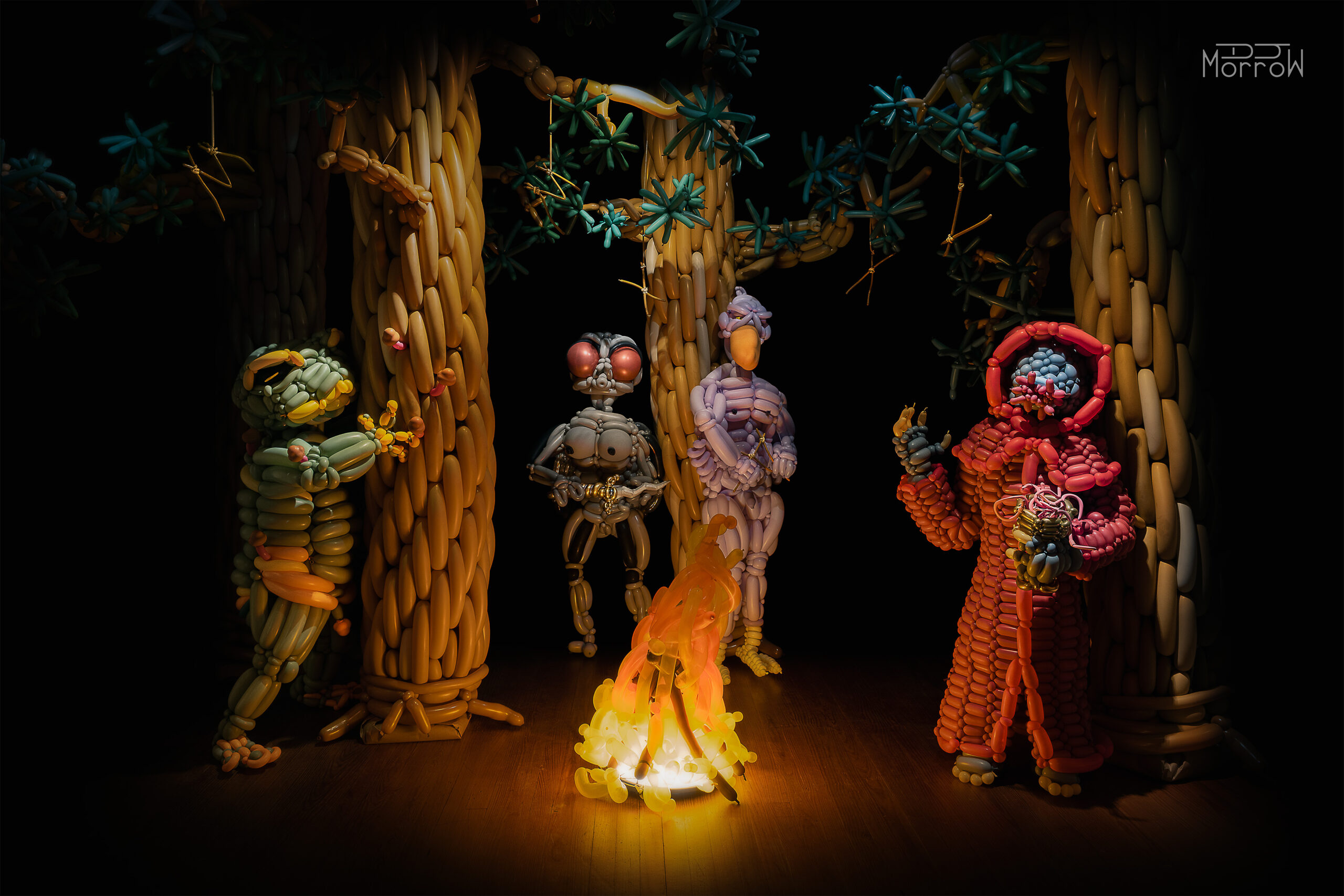 balloon installation with pine tree forest and 4 figures with animal features gathering for cult rituals
